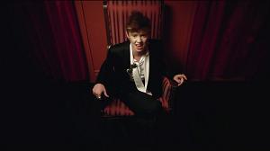 A screen shot from its music video. A screen shot from its music video.